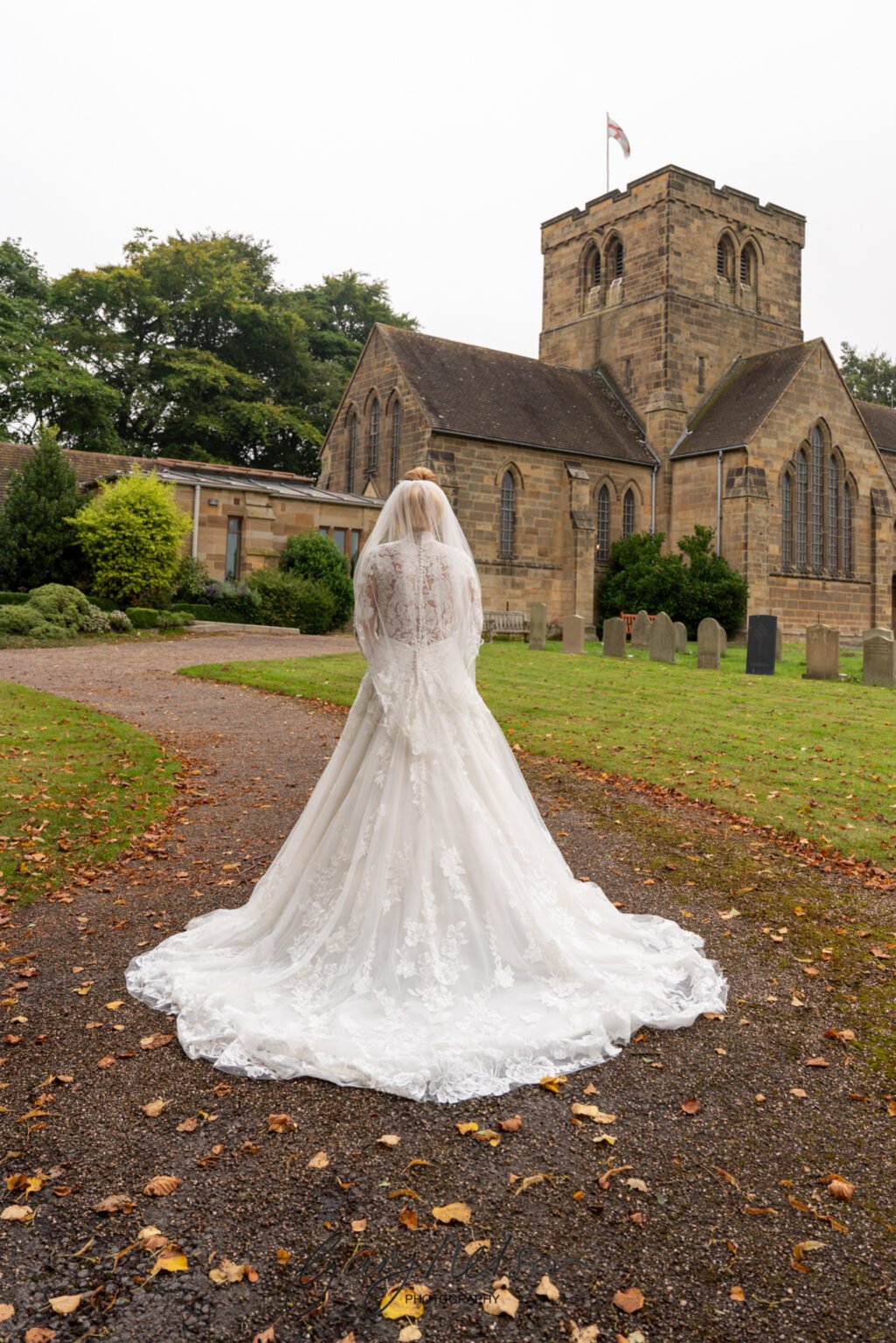 Parish Church of St. Mary the Virgin, Church Ln, Middlesbrough TS7 0PD Wedding bride in front of churcg
