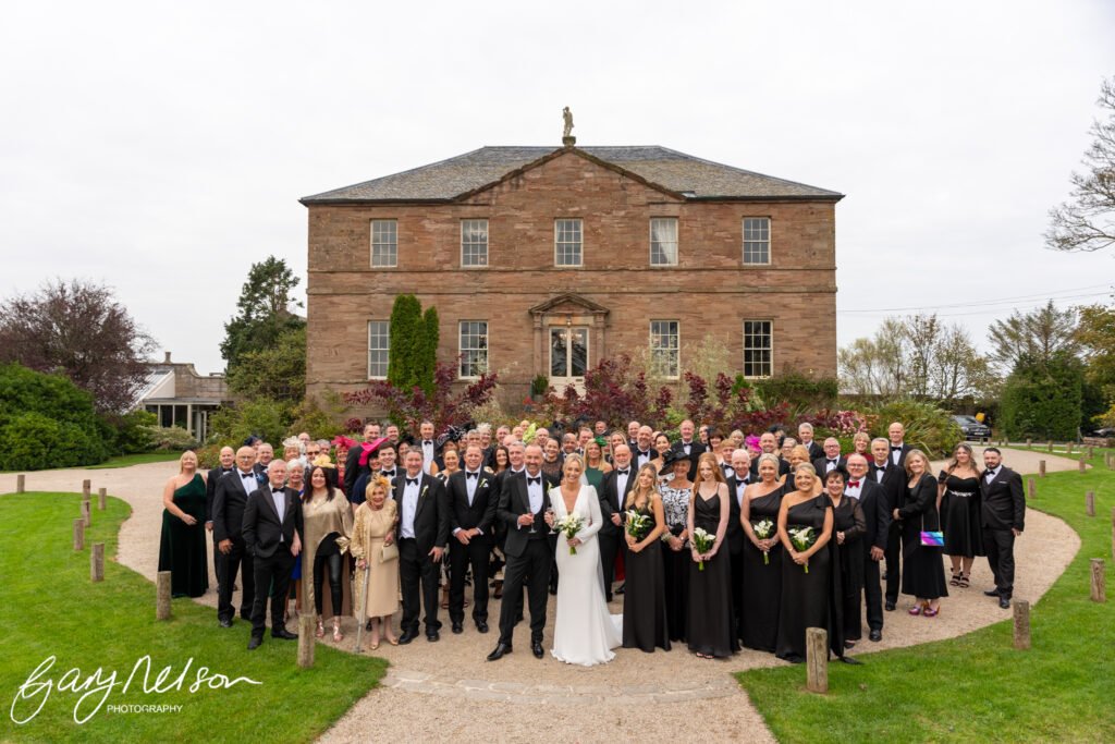 Newton Hall, High Newton-by-the-Sea, Alnwick NE66 3DZ wedding group photo in front of of hall