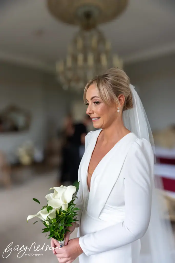 Newton Hall, High Newton-by-the-Sea, Alnwick NE66 3DZ wedding bride with flowers