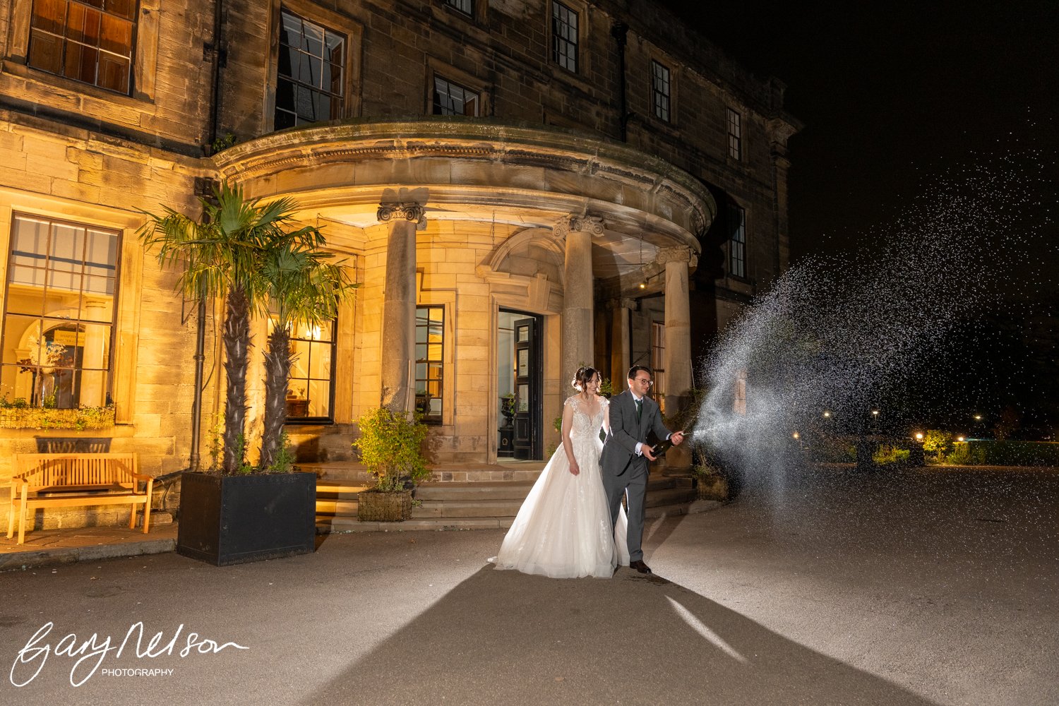 beamish hall hotel wedding couple champagne spray